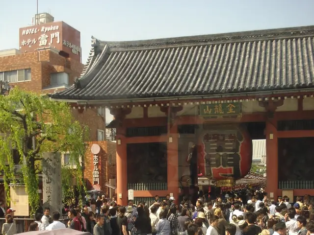 In this picture we can see some people are standing, on the left side there is a rickshaw and a...