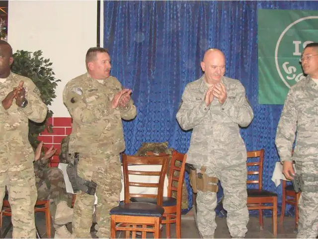 These four persons are standing. These three persons are clapping. A banner on curtain. These...