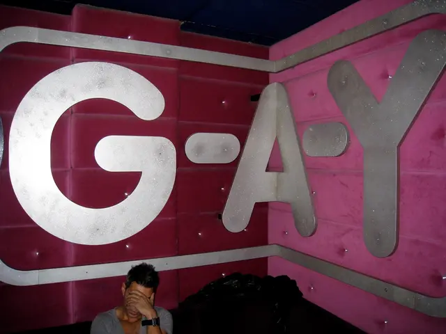 In this image at the bottom there is one man who is sitting and beside him there are some covers,...