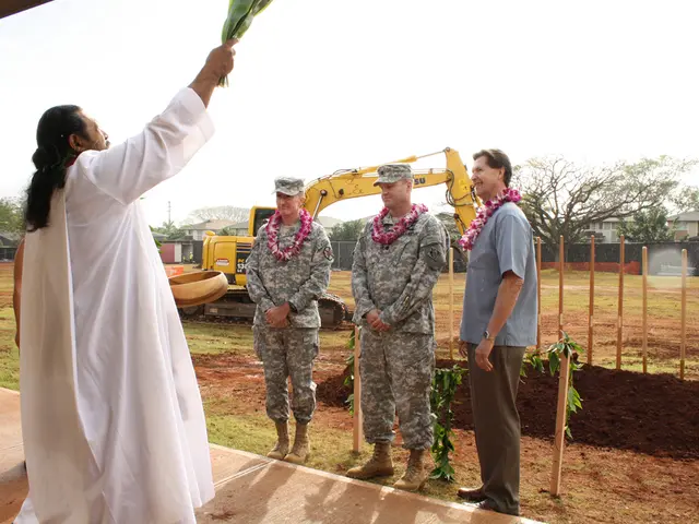 In this picture there is a man wearing white dress standing in the front. Behind there are two...