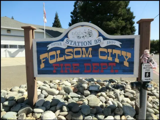 In this image we can see the entrance arch placed above the rocks on the road. In addition to this...