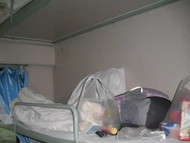 It seems like this image is clicked inside the train. We can see the seats, there are blankets,...