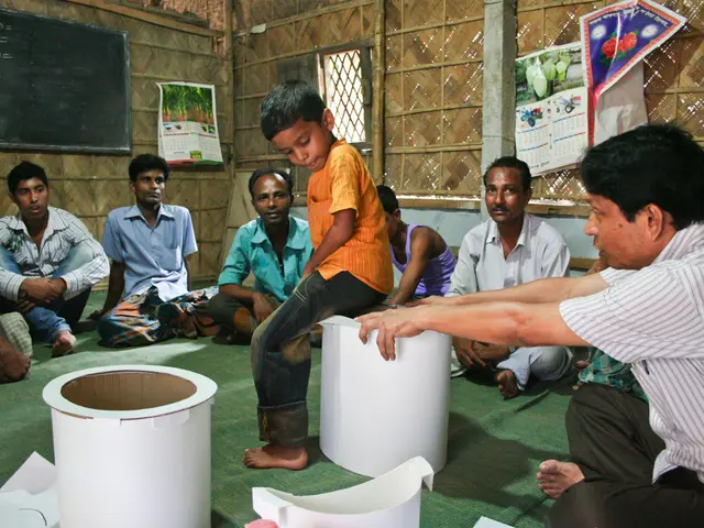 In this image there is a kid sitting on an object, around the kid there are few men sitting on the...