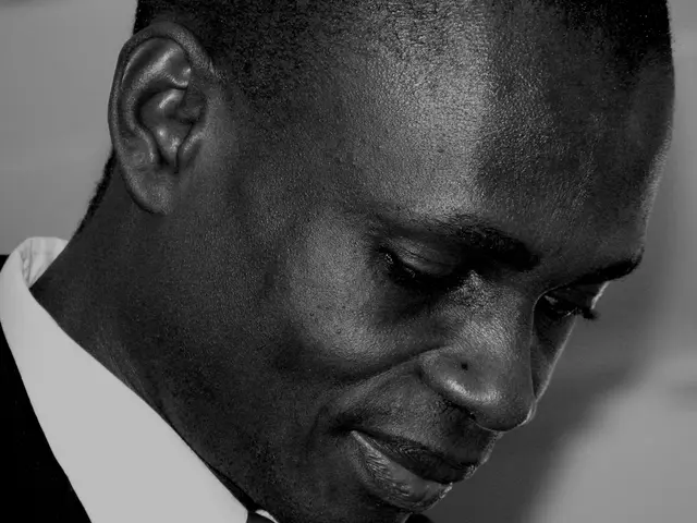 In this image we can see a man smiling.