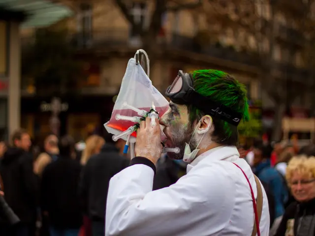 In this image on the foreground a person wearing white dress is wearing a safety glasses and mask....