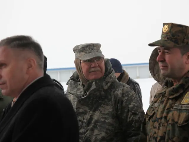 There are group of people standing. I can see two people wore hats. This is the badge attached to...