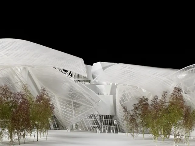 In this image there is a museum in the middle. There are trees on either side of it.