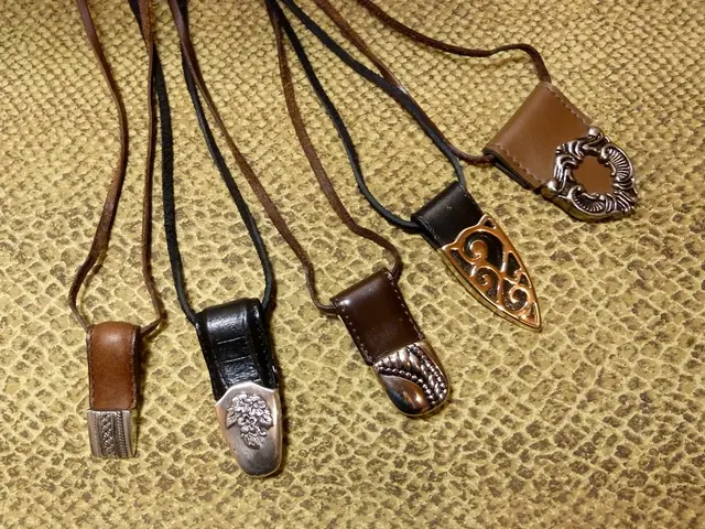 In this image there are belts which are on the yellow colour surface.