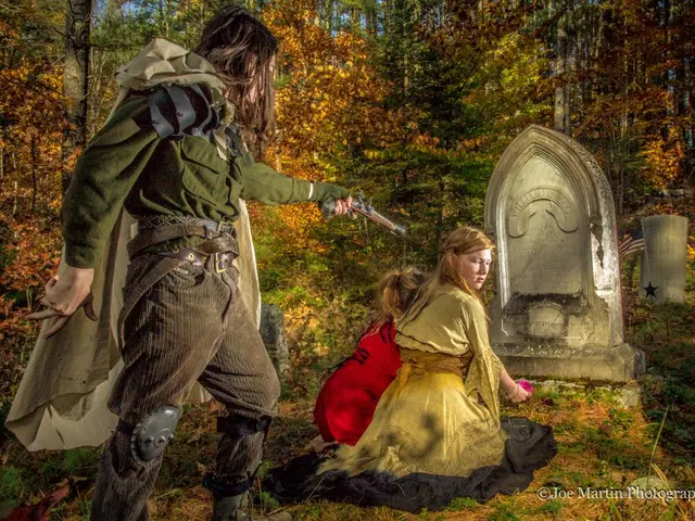 In this picture we can see a grave on the path. There are two people visible on the path. We can...