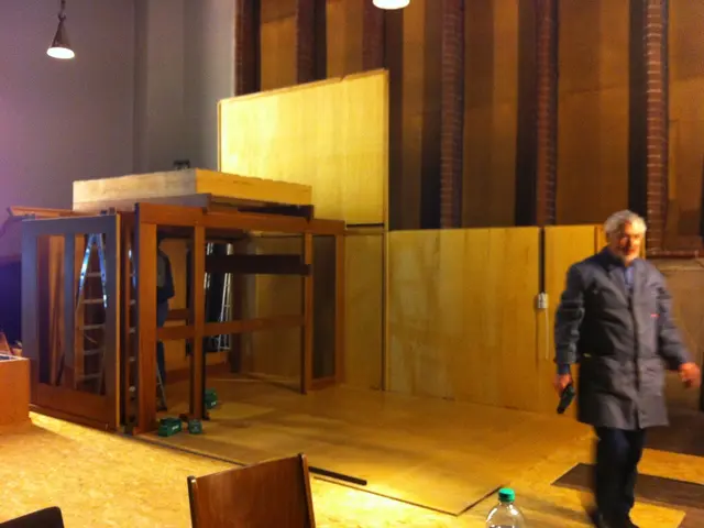 In the image on the right side there is a man walking and holding a gun in his hand. At the bottom...