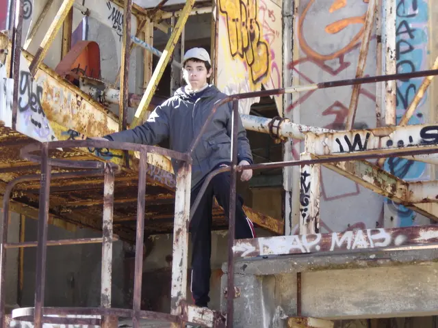 In this image we can see a boy. He is wearing a jacket and there is a cap on his head. Here we can...