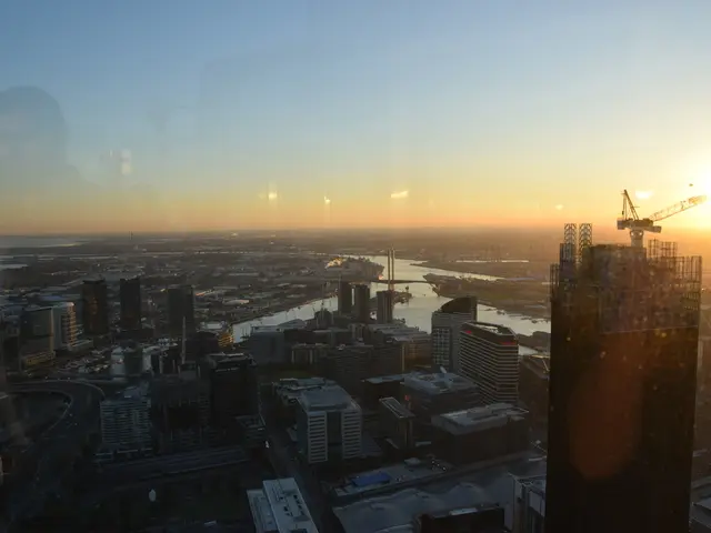 In this image we can see the aerial view of the city. There are so many buildings at the bottom and...