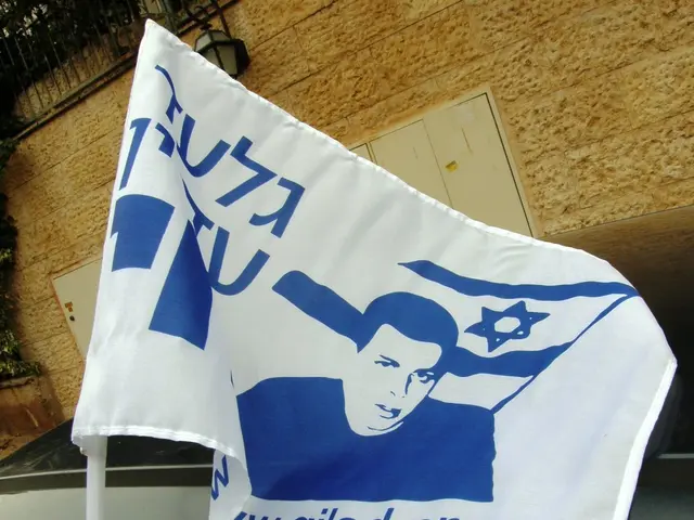 As we can see in the image there is a vehicle, flag, building, fence and street lamp.