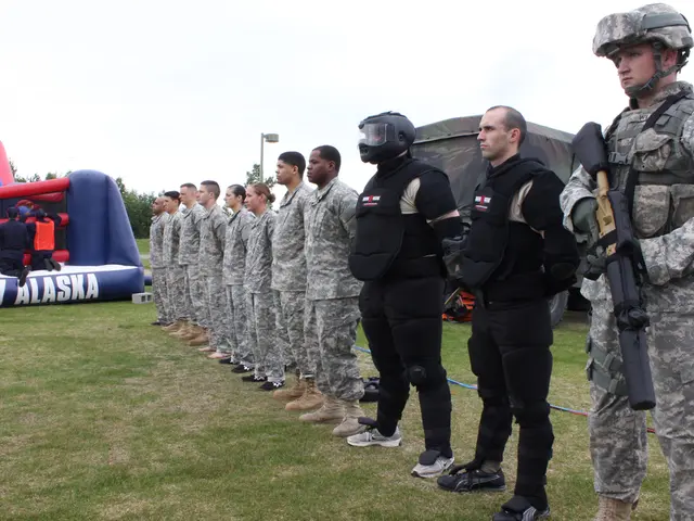 This picture describes about group of people, few people wore helmets, on the right side of the...