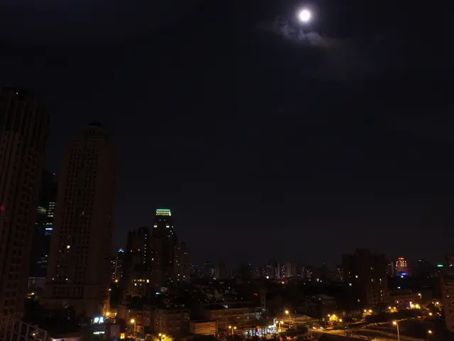 The picture is captured in the night time,it is a beautiful view of a city with tall...