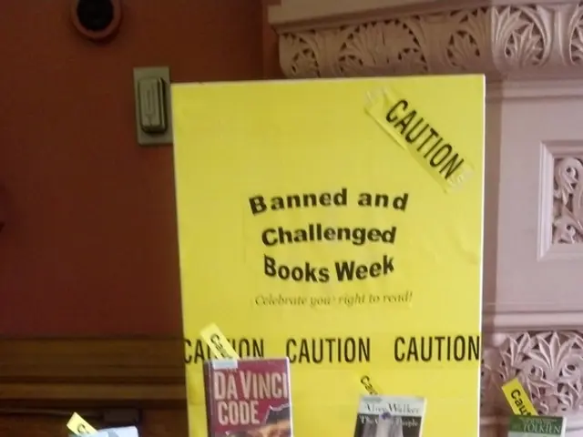 In the picture there is a table in which on the table there are many books near to the table there...