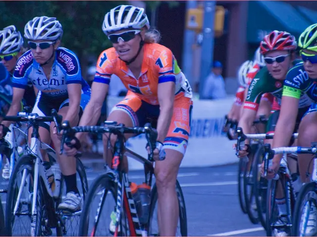 This picture is clicked outside. In the center we can see the group of people wearing helmets and...