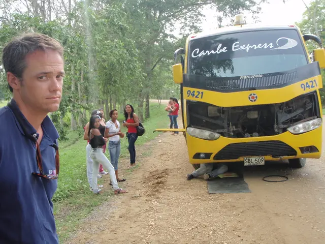 In this image on the right there is one bus and on the left there are some persons who are standing...