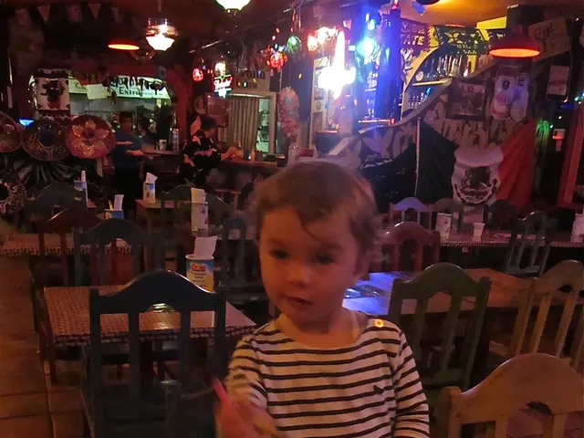 This picture describe about inside view of the restaurant in which many table and chairs are...