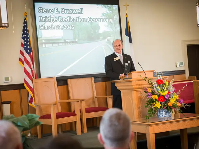 This is the podium with two mikes on it. Here is the man standing and talking. These are the two...