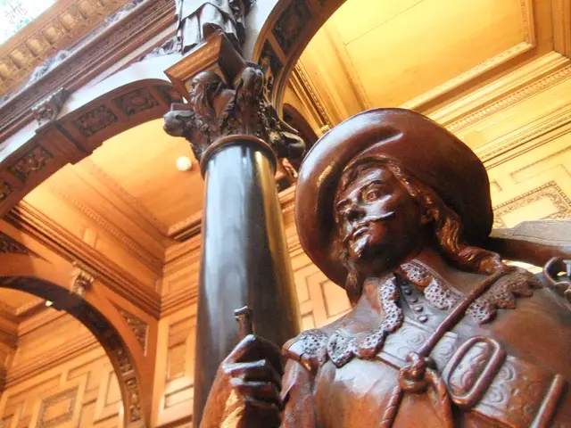 In the image,it looks like a palace and there is a pillar,beside the pillar there is sculpture of a...