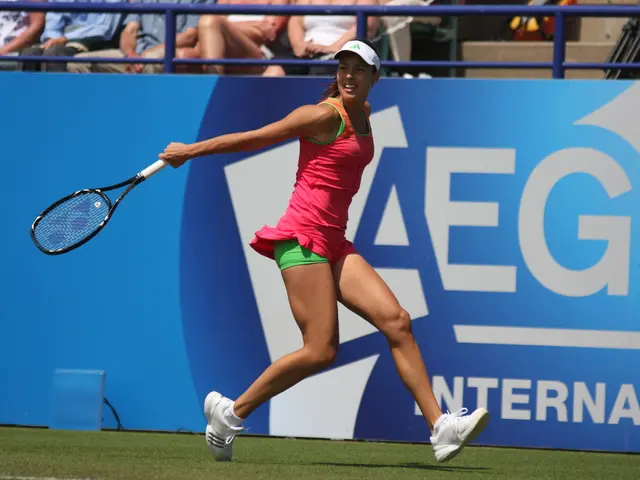 In this picture there is a woman playing a badminton holding a bat in her hand. She is wearing a...