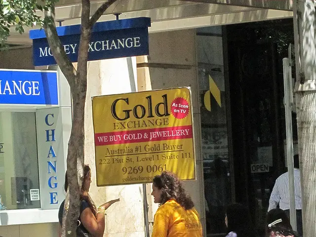 This image is clicked outside. There are shops in the middle. There is cycle in the middle. There...