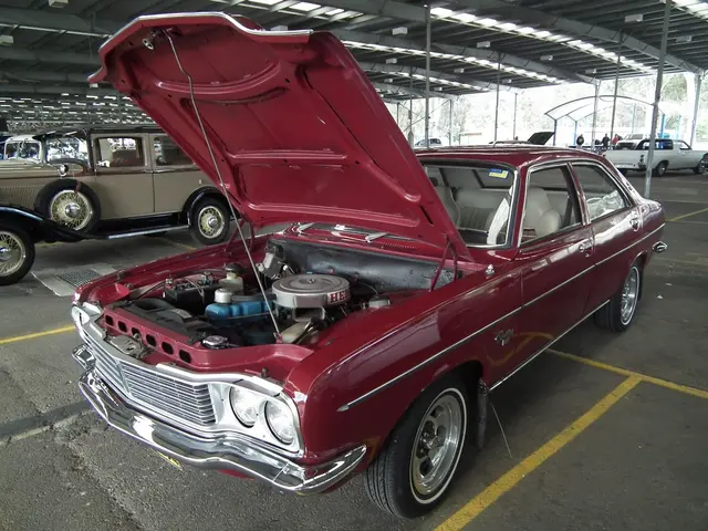 This is a shed in which there are some different colors and models of cars and at the background of...