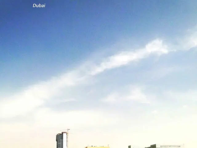 In the center of the image there are railway tracks. On the right side of the image we can see...