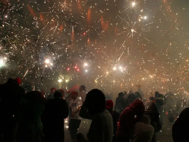 In this image we can see so many people are standing and they are burning crackers.