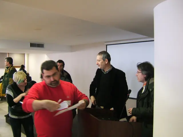 In this image we can see people standing on the chairs and some are sitting on the chairs and one...