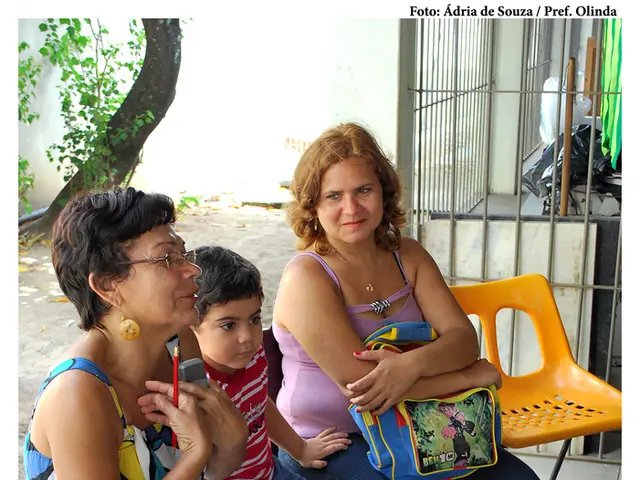 In this picture we can find two women and one child sitting on a bench, beside them there is one...
