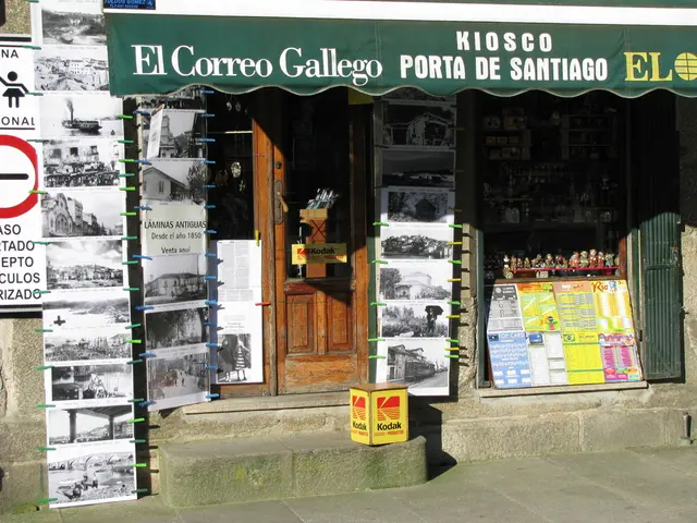 In this image, there are few objects in a shop. There are posters with clips, a board and a door....