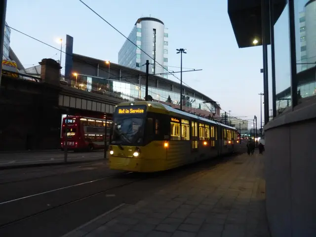 In this picture I can see there is a bus on to right and left and there are few buildings into...