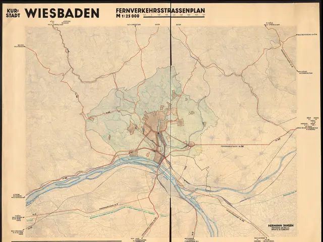 The image shows an old map of the city of Wiesbaden, Germany, framed in a photo frame. The map is...