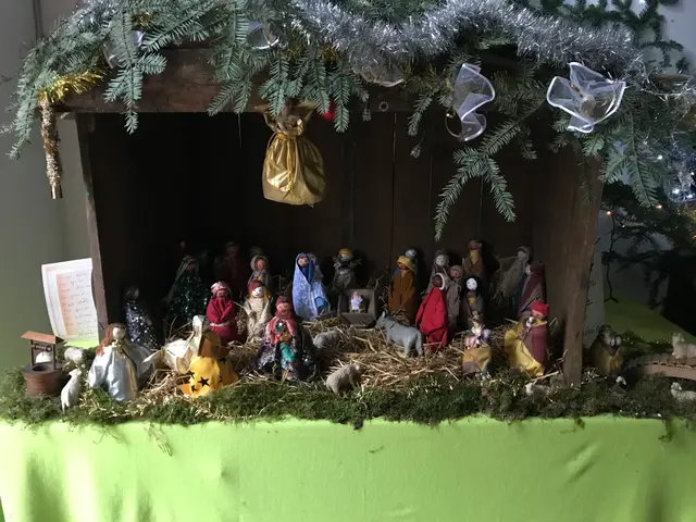 The image shows a nativity scene with a baby Jesus in a manger surrounded by toys, grass, and other...