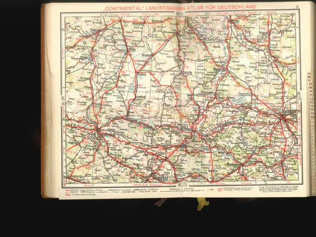 The image shows an open book with a map of Germany on it, set against a black background. The map...