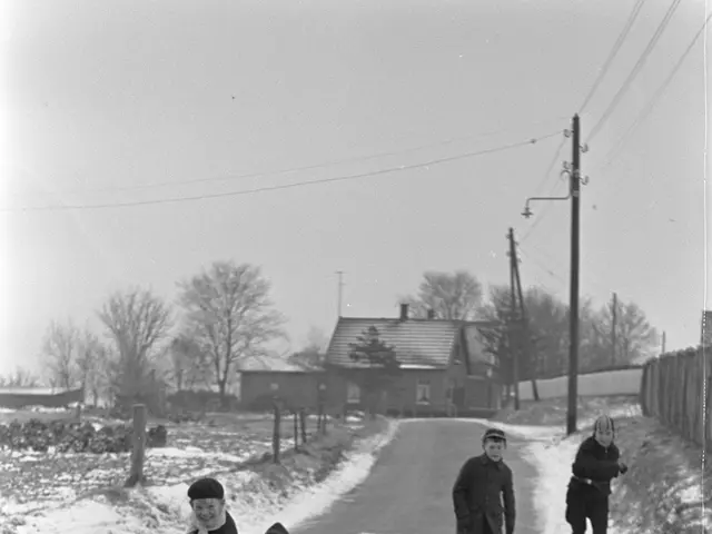 The image shows a group of children sledding down a snowy road, wearing coats and caps. In the...