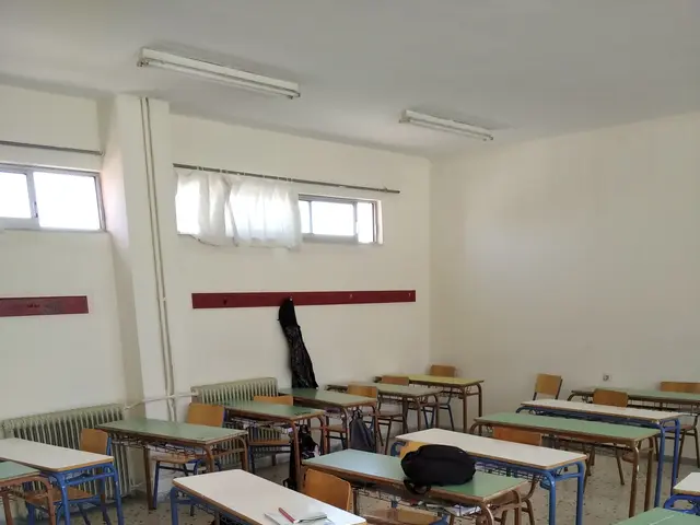 The image shows an empty classroom with desks and chairs arranged in neat rows, books and other...