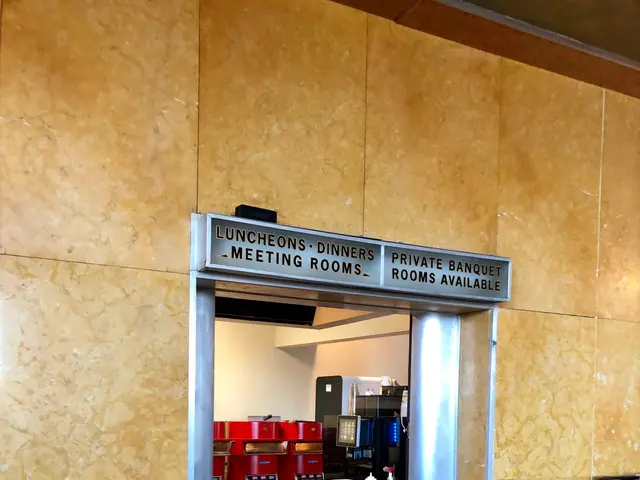 The image shows a restaurant with a counter and a sign on the wall. On the left side of the image...