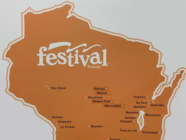 The image shows a poster of a map of Wisconsin with the words "Festival Foods" printed on it. The...