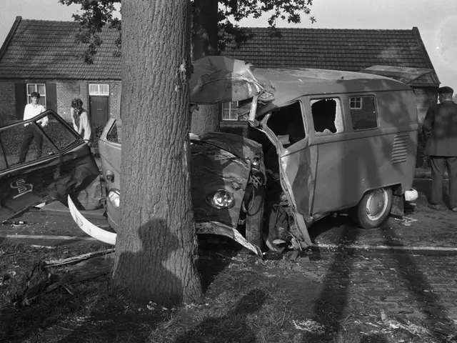 The image shows a black and white scene of a car that has been involved in a crash on the side of...