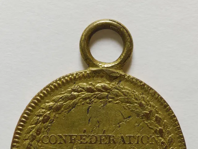 The image shows a gold medal with the words "Confederation des Francois" inscribed on it against a...