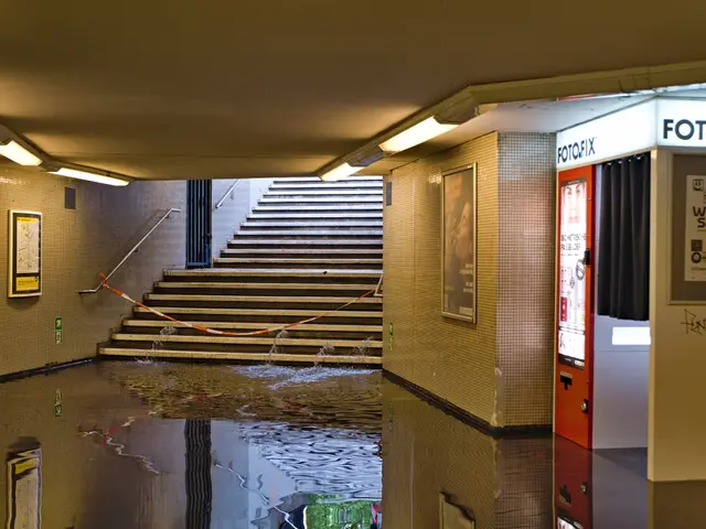 The image shows a flooded subway station in Berlin, Germany, with water on the floor, steps with...