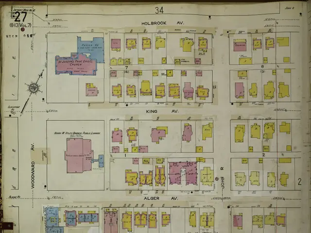 The image shows an open book with a map of a city on it. The map is detailed and shows the various...