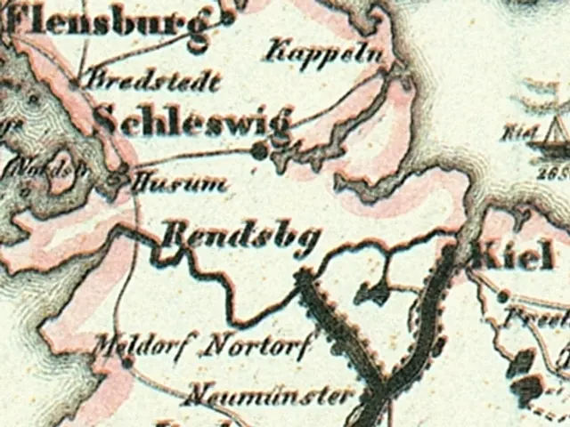 The image shows an old map of the city of Schleswig-Holstein, with text written on it. The map is...