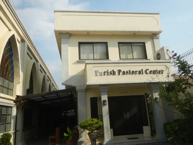 The image shows the parish pastoral center in Manila, Philippines. It is a building with windows...