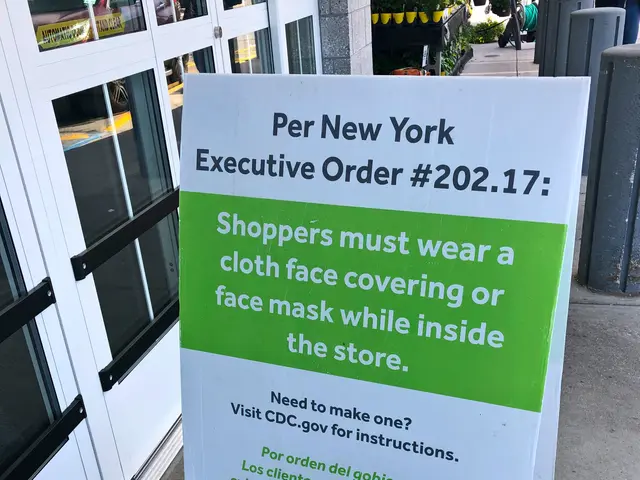 The image shows a sign on the sidewalk in front of a store with a sign that reads "Per New York...