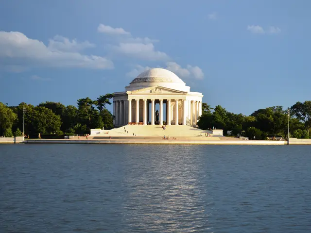 The image shows the Jefferson Memorial in Washington DC, with its iconic pillars and steps leading...