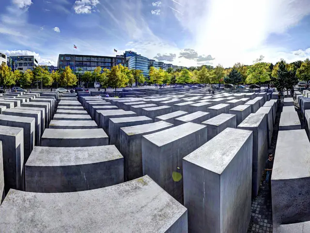 The image shows the Holocaust Memorial to the Murdered Jews of Europe in Berlin, Germany. It is a...